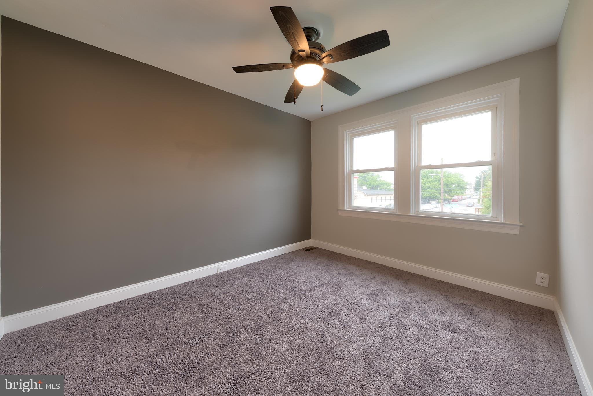 99 Willow Spring Road Baltimore, MD 21222 - Photo 26 of 30 an empty room with a window and a fan