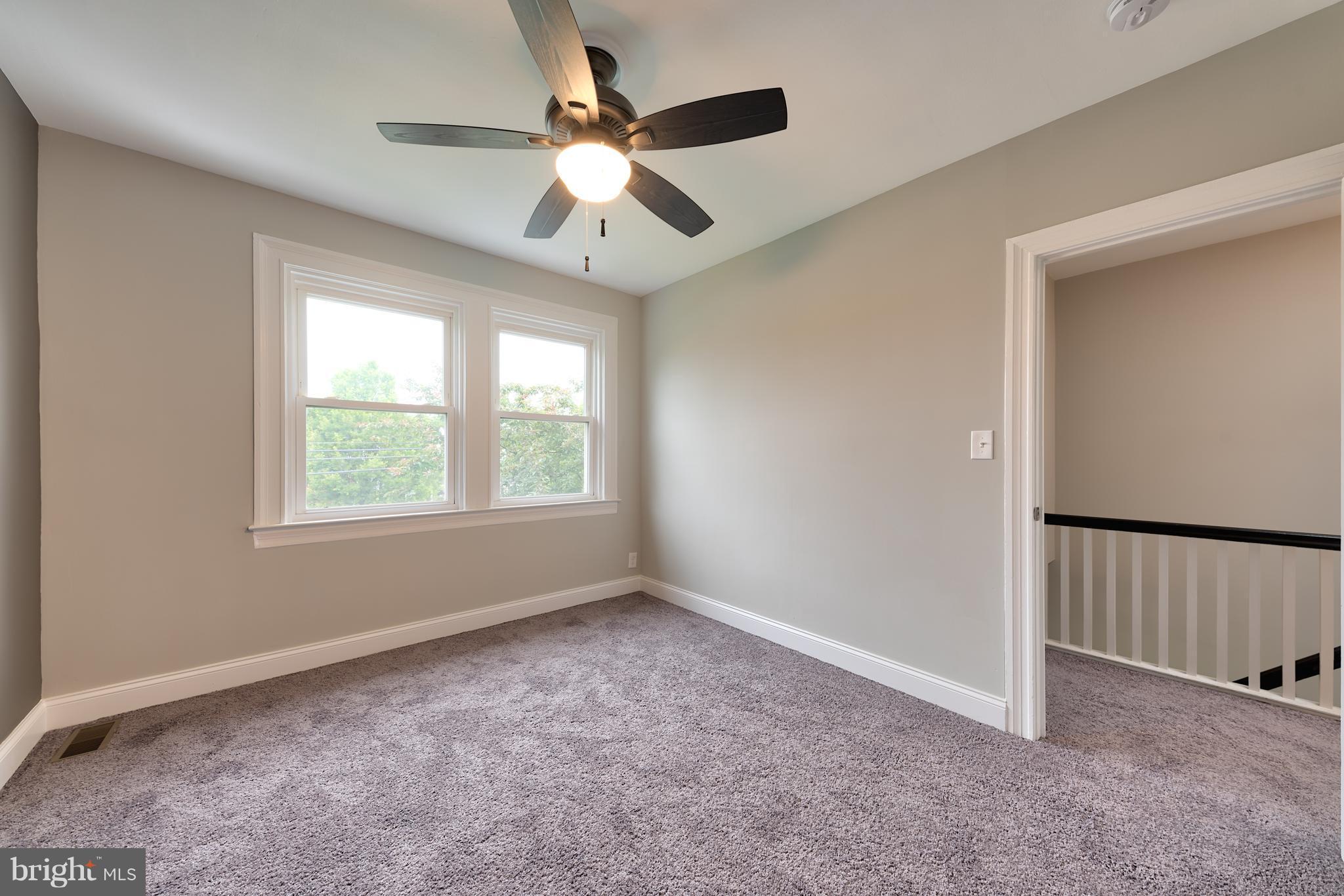 99 Willow Spring Road Baltimore, MD 21222 - Photo 29 of 30 an empty room with windows and fan