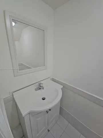a bathroom with a sink and vanity