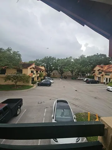 a view of car parked on the side of a lake