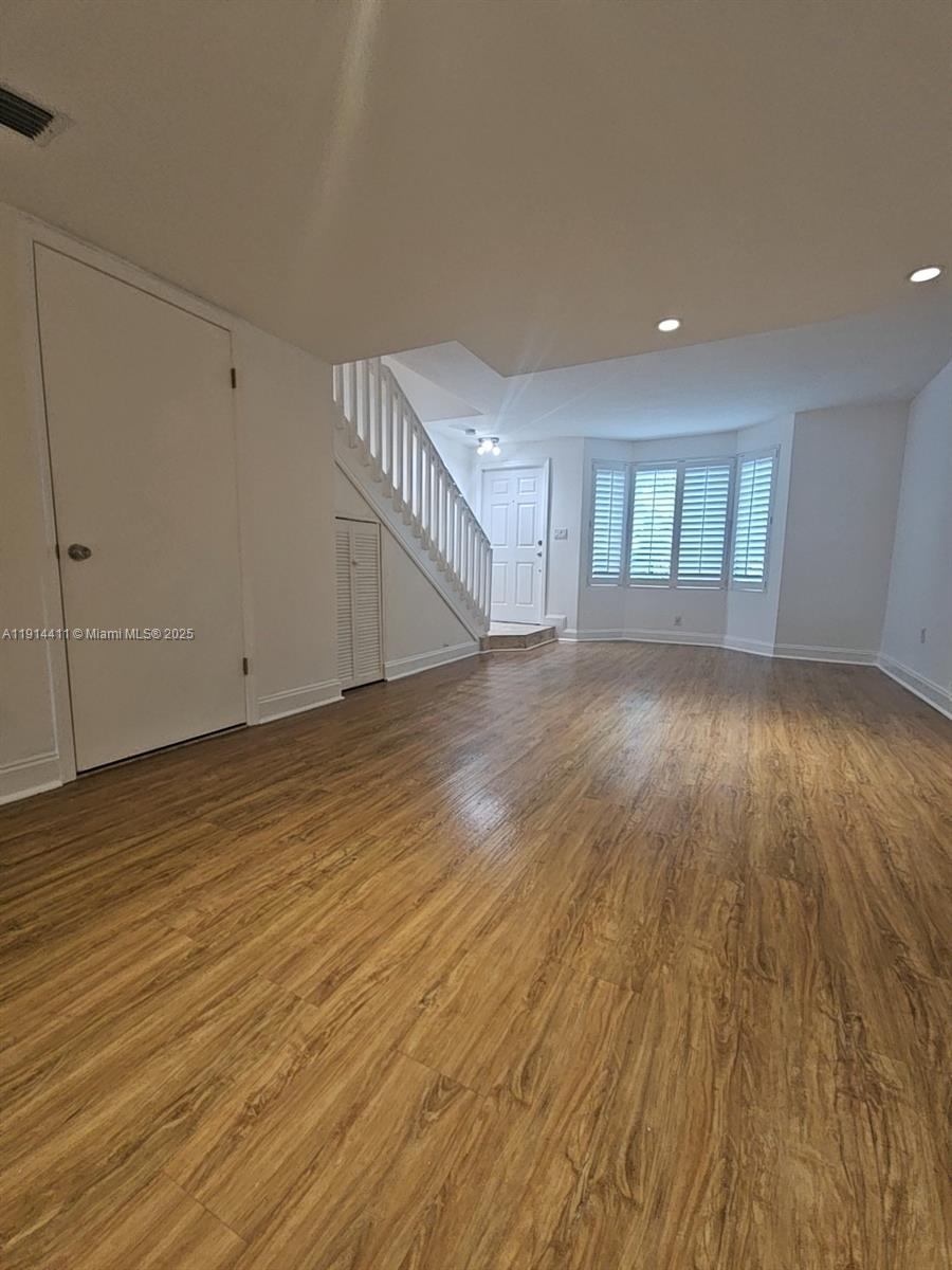 7870 Southwest 102nd Lane Miami, FL 33156 - Photo 6 of 41 wooden floor in an empty room with a window