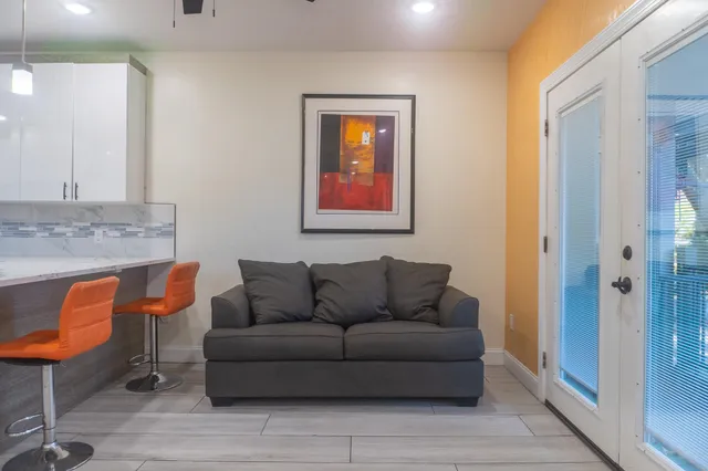 a living room with furniture and a window