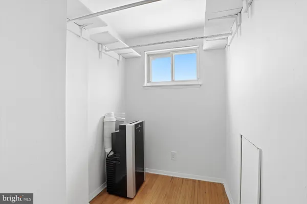 a view of a room with wooden floor