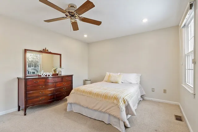 a bedroom with a bed and furniture