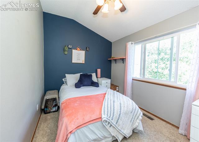7848 Swiftrun Road Colorado Springs, CO 80920 - Photo 29 of 37 Second bedroom on upper level with ceiling fan