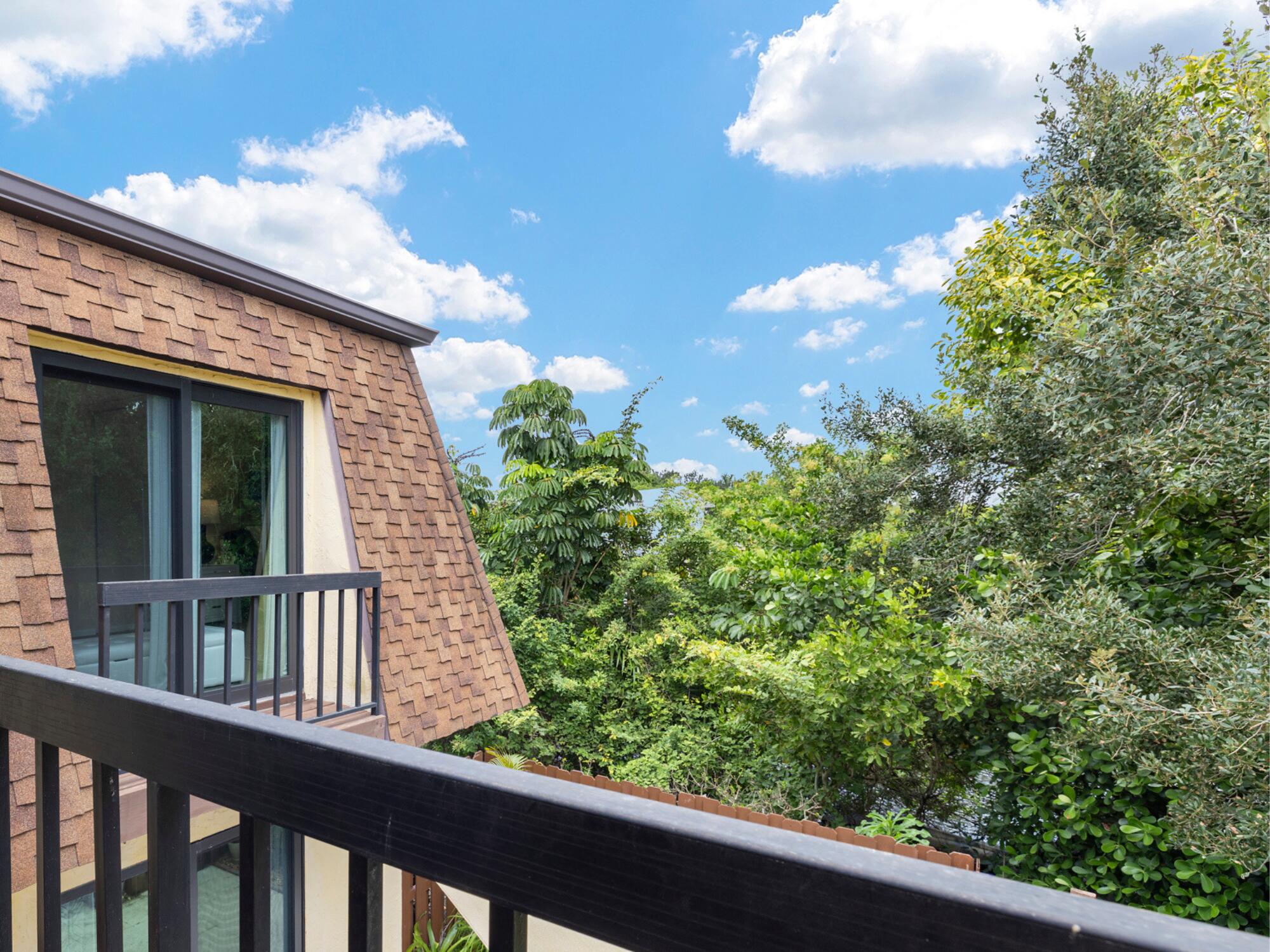 110 North Delaware Boulevard, Unit 18A Jupiter, FL 33458 - Photo 21 of 30 a view of a balcony with a tree