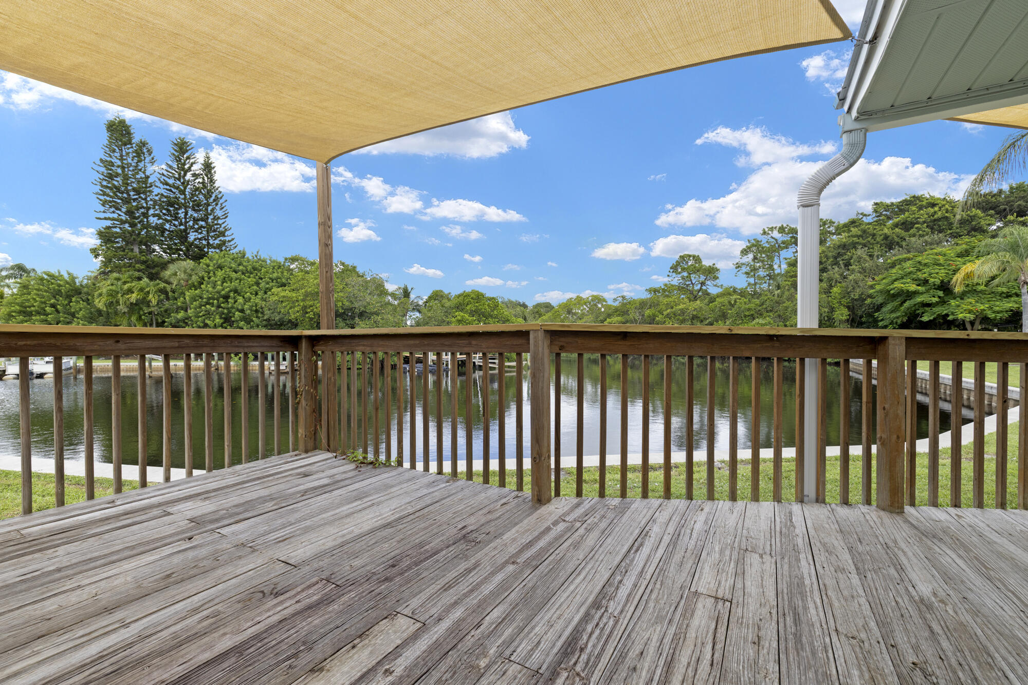 110 North Delaware Boulevard, Unit 18A Jupiter, FL 33458 - Photo 26 of 30 a view of wooden deck with a lake view