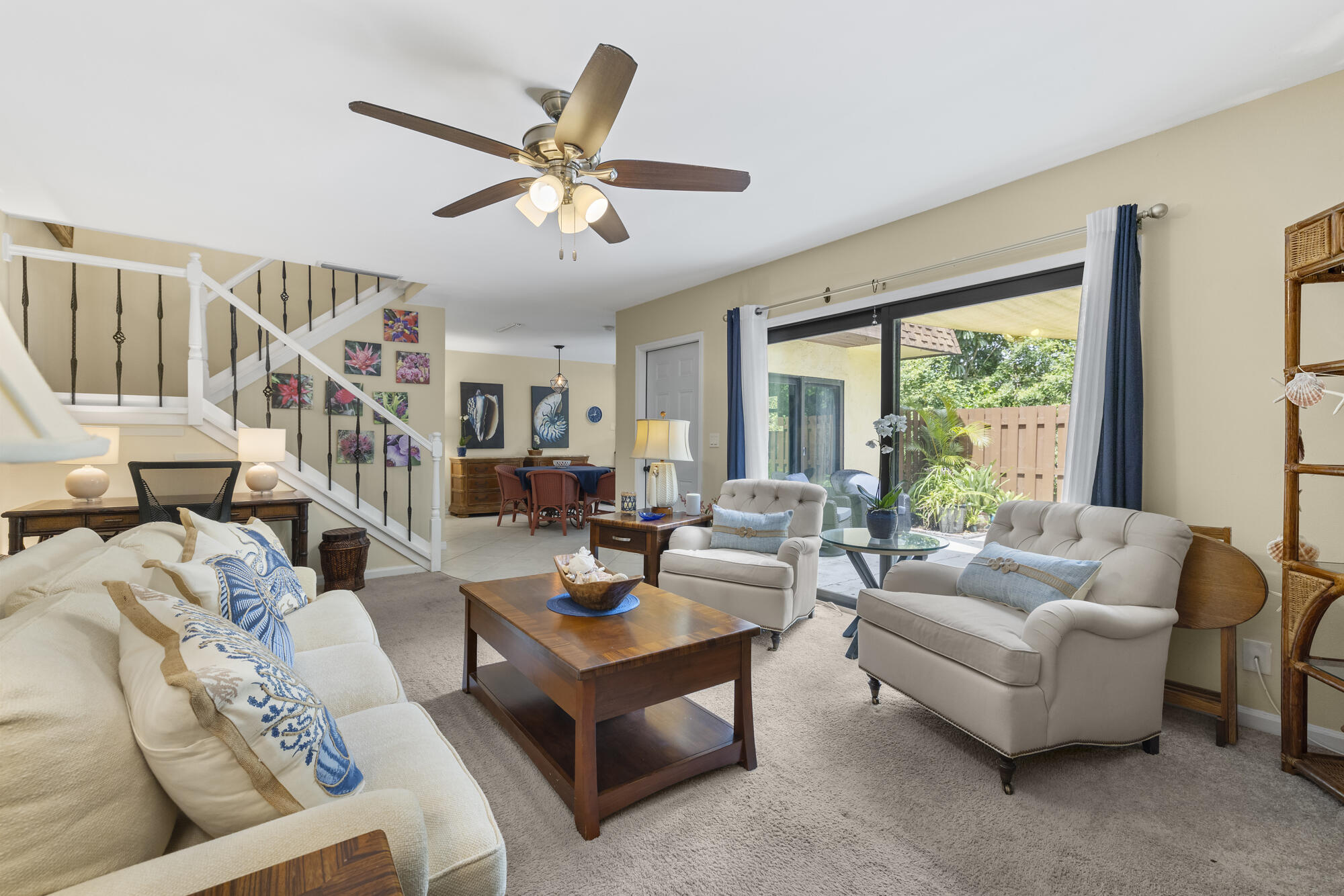 110 North Delaware Boulevard, Unit 18A Jupiter, FL 33458 - Photo 7 of 30 a living room with furniture and a large window