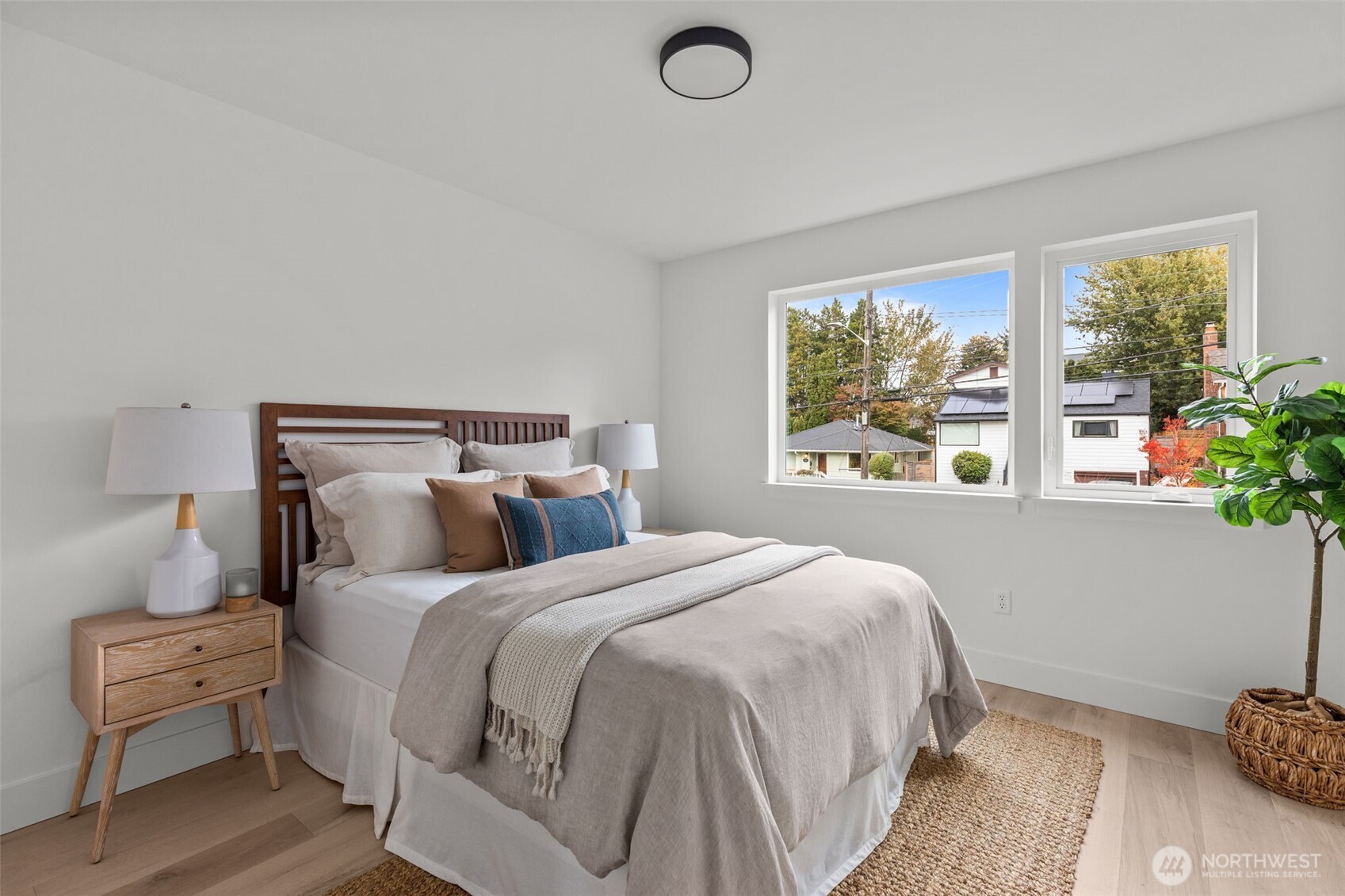 8405 42nd Avenue Southwest Seattle, WA 98136 - Photo 13 of 34 a bedroom with a bed and a window