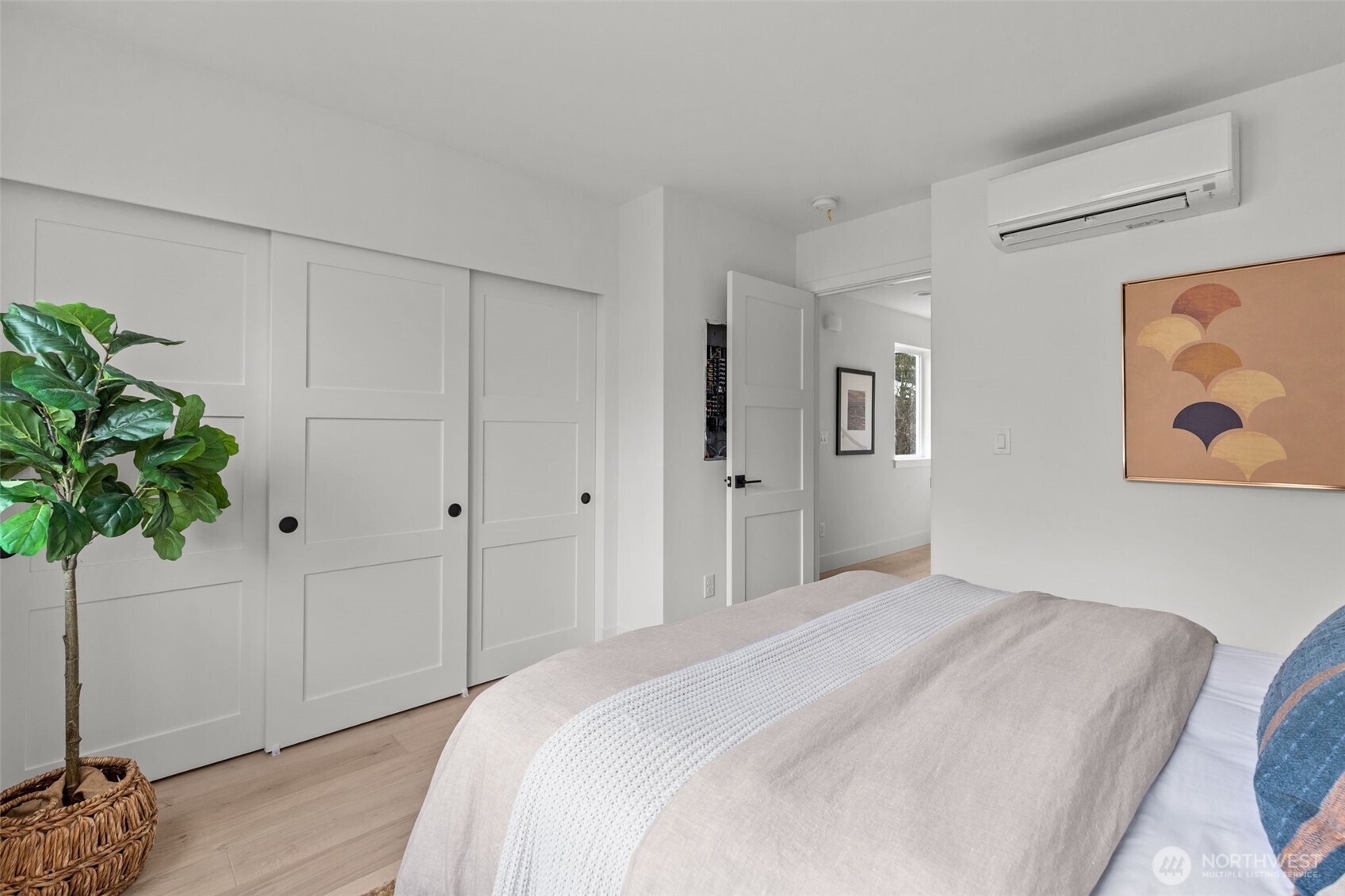 8405 42nd Avenue Southwest Seattle, WA 98136 - Photo 15 of 34 a bedroom with a bed and a potted plant