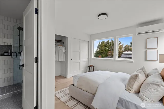 a bedroom with a bed and a window