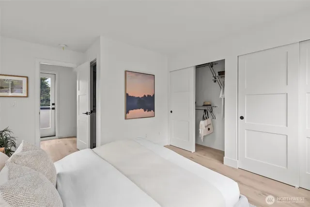 a bedroom with a bed and a bathroom