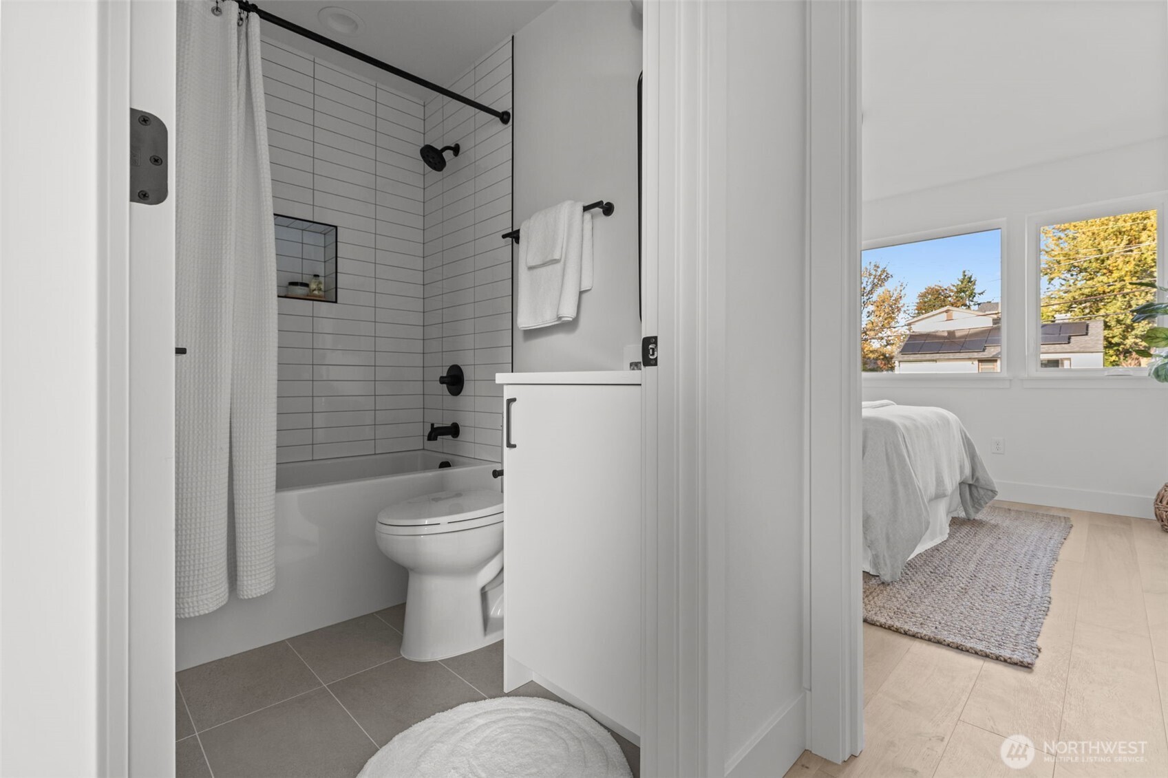 8405 42nd Avenue Southwest Seattle, WA 98136 - Photo 25 of 34 a bathroom with a toilet a sink and shower