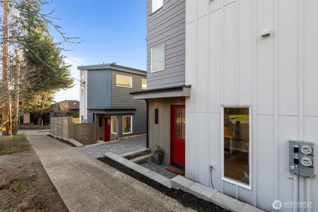 a front view of a house with parking area