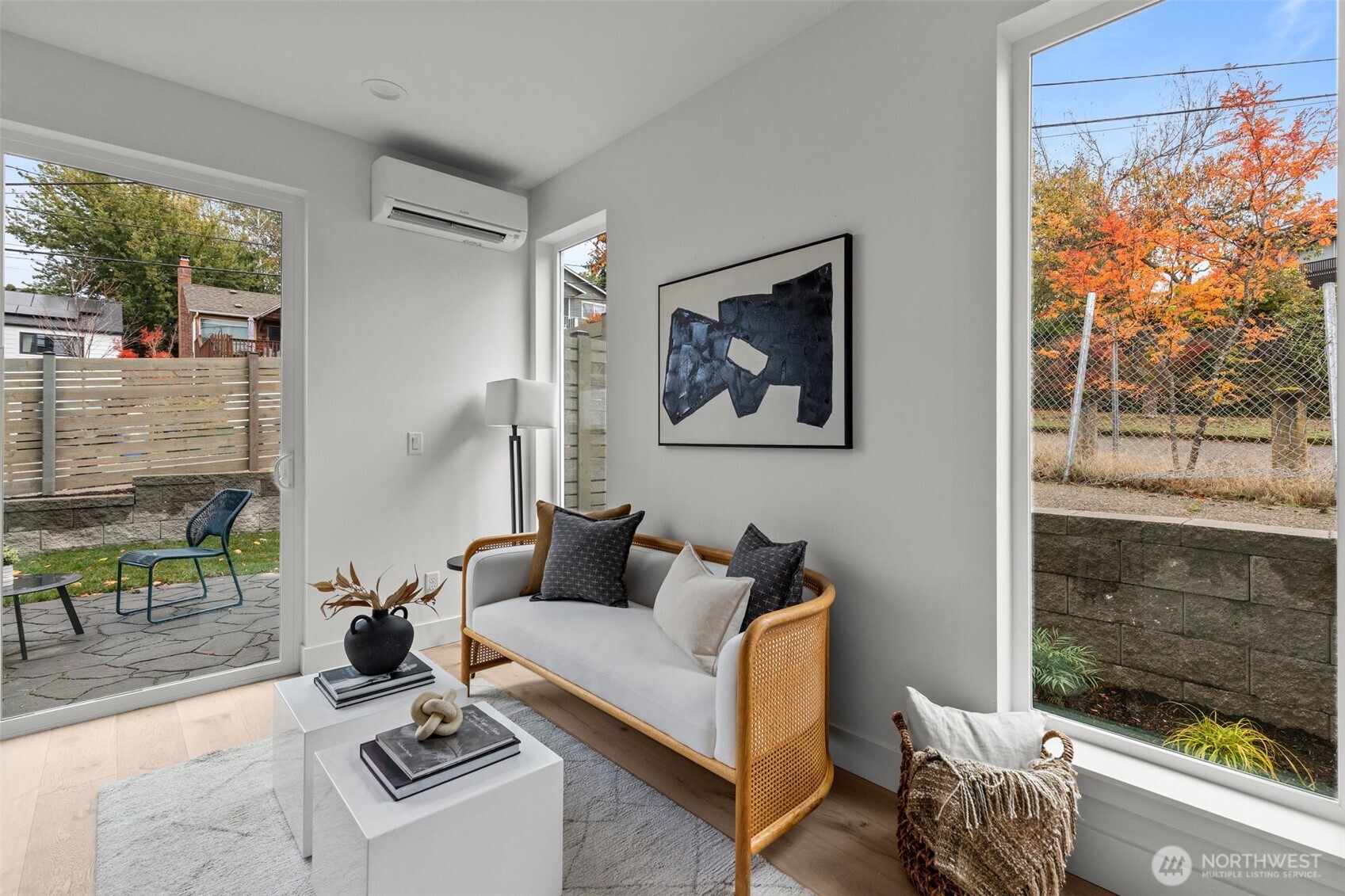 8405 42nd Avenue Southwest Seattle, WA 98136 - Photo 5 of 34 a living room with furniture a window and a painting on the wall