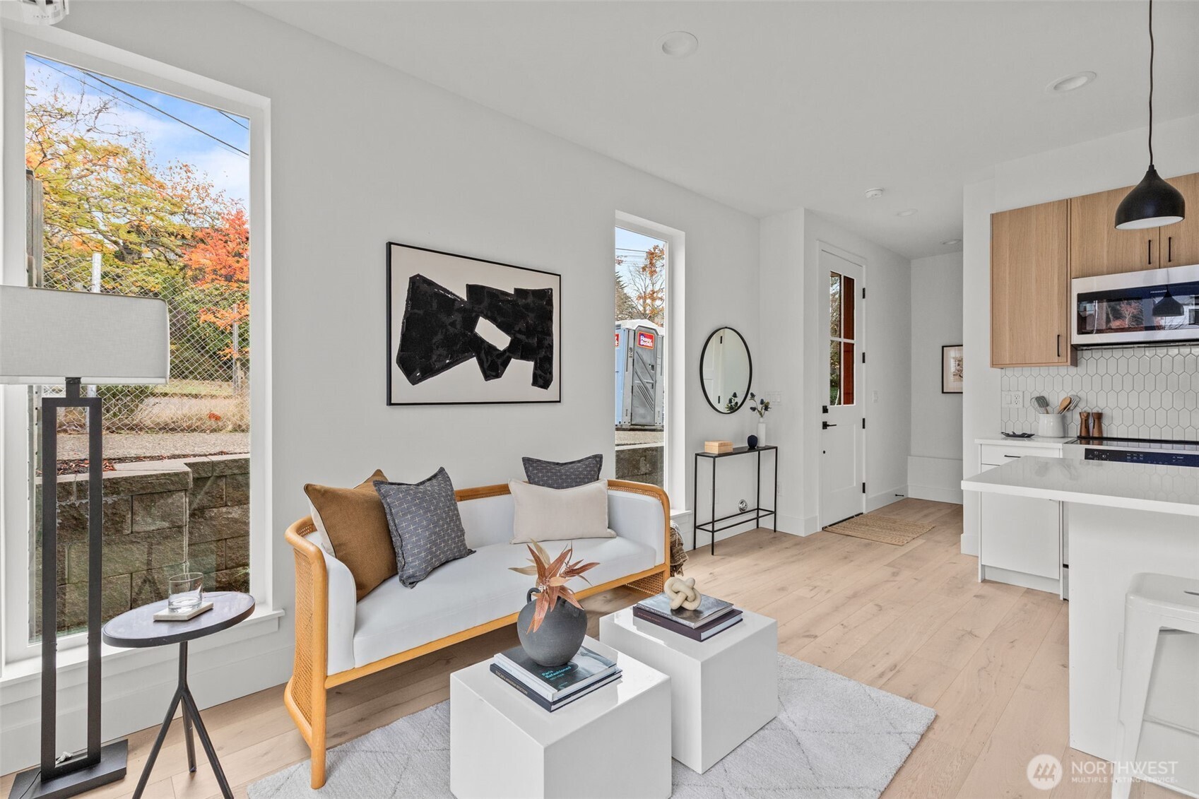 8405 42nd Avenue Southwest Seattle, WA 98136 - Photo 6 of 34 a living room with furniture a rug and white walls