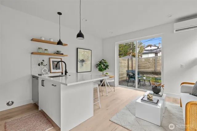 a living room with furniture and large windows