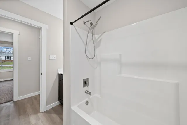 a bathroom with a bath tub