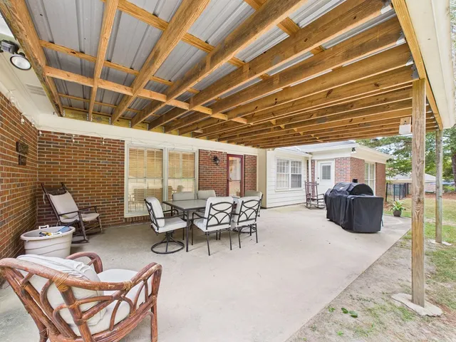 a outdoor space with patio lots of furniture