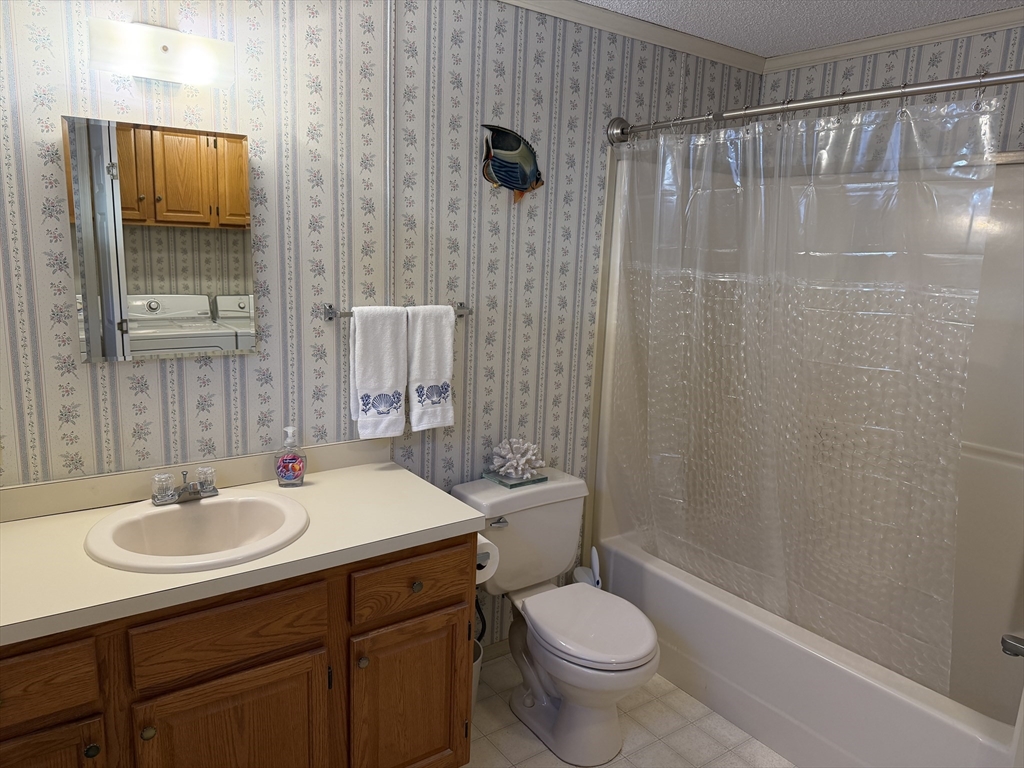 5 Virginia Avenue Marlborough, MA 01752 - Photo 11 of 19 a bathroom with a sink toilet a mirror and shower
