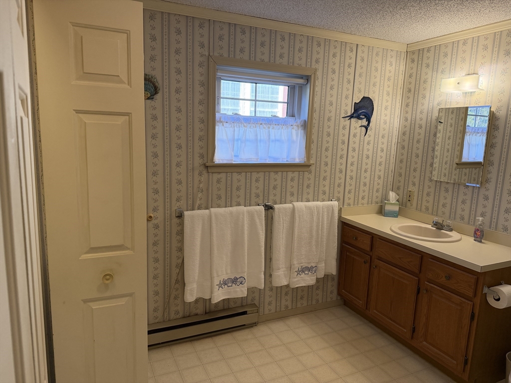 5 Virginia Avenue Marlborough, MA 01752 - Photo 12 of 19 a bathroom with a sink and a mirror