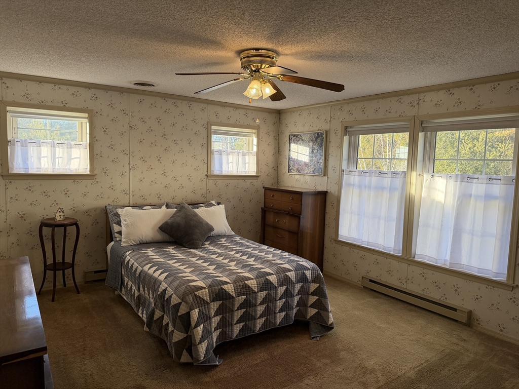 5 Virginia Avenue Marlborough, MA 01752 - Photo 17 of 19 a bedroom with a bed and a chandelier