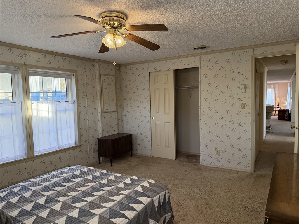 5 Virginia Avenue Marlborough, MA 01752 - Photo 18 of 19 a bedroom with a bed and a chandelier