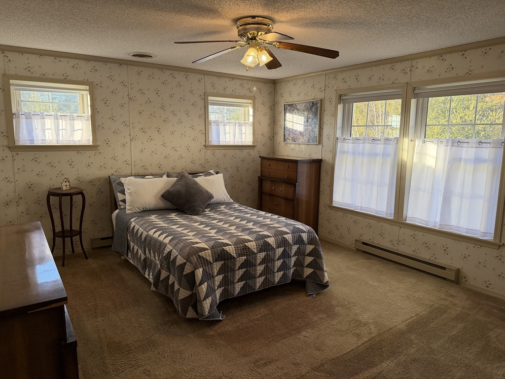5 Virginia Avenue Marlborough, MA 01752 - Photo 10 of 19 a bedroom with a bed lamp and window