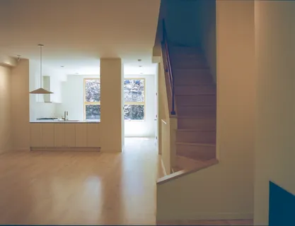 a view of an empty room and a window