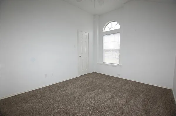 an empty room that has a window