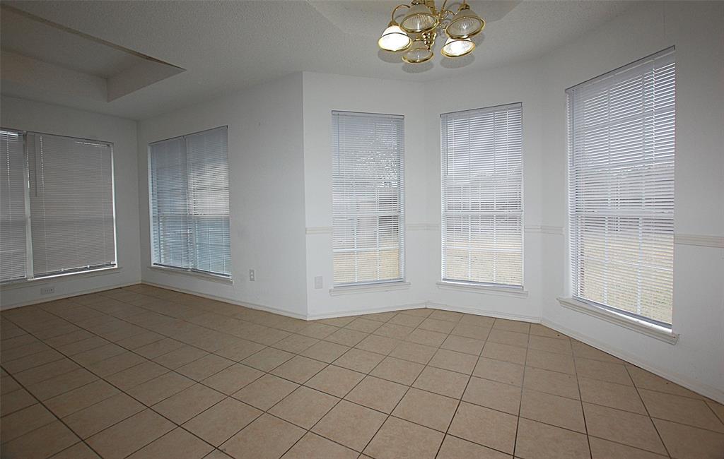 122 Princeton Circle Forney, TX 75126 - Photo 4 of 17 a view of an empty room with a window