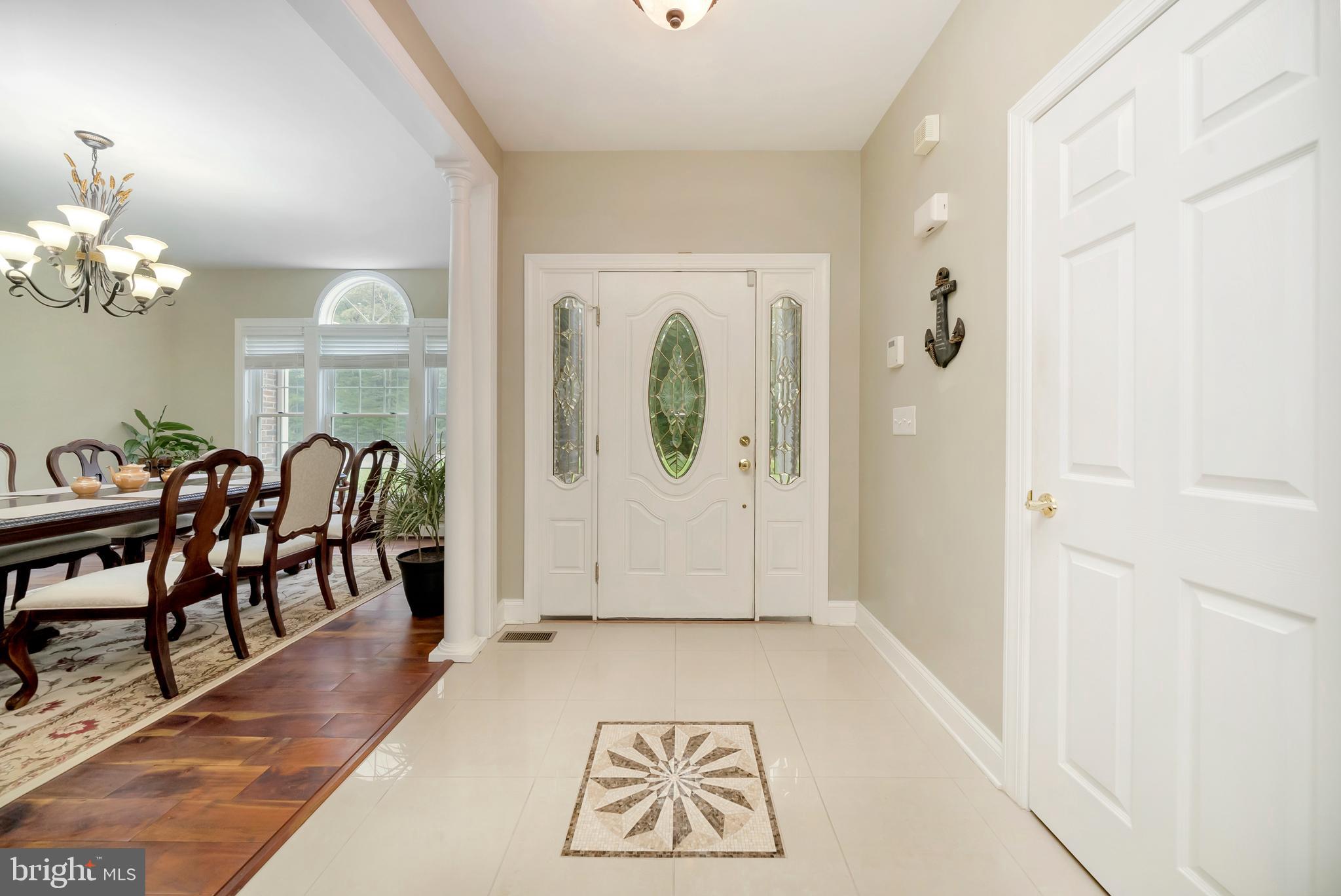 5800 Hickory Ridge Road Spotsylvania, VA 22551 - Photo 4 of 35 Porcelain Tile Foyer with Inlaid Star Medallion