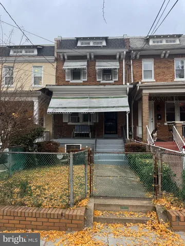 a front view of a house with swimming pool