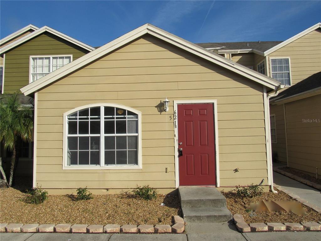 621 Washington Palm Loop, Unit LOCKOUT Davenport, FL 33897 - Photo 1 of 1 a front view of a house