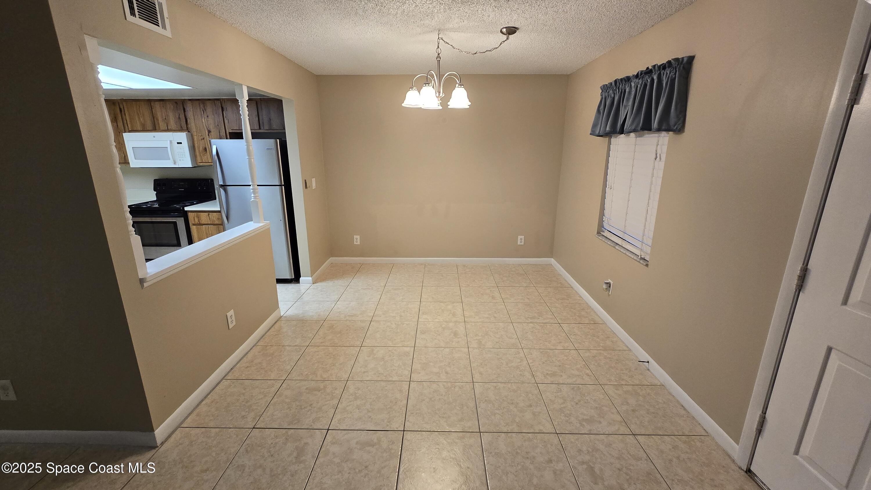 3213 Murrell Road, Unit 103 Rockledge, FL 32955 - Photo 3 of 13 20251006_122642