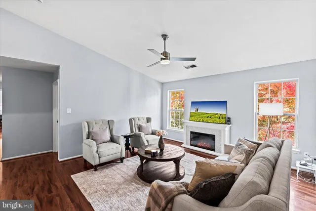 a spacious bedroom with a bed and wooden floor