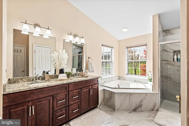 a living room with furniture a rug and a flat screen tv