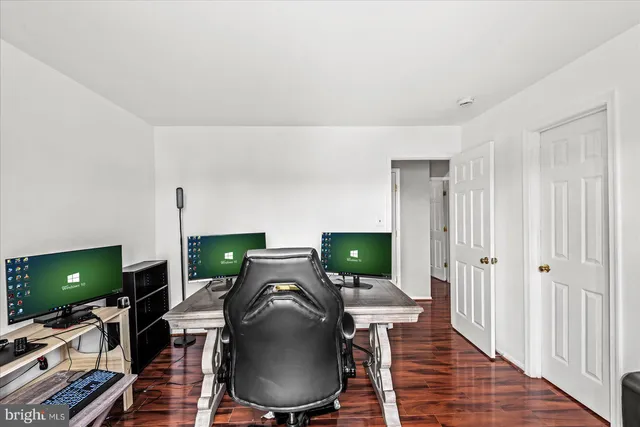 a view of a roof deck with furniture