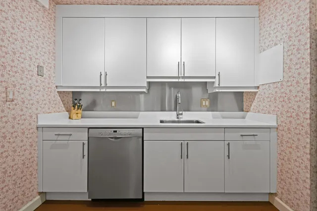 a kitchen with a refrigerator stove and microwave