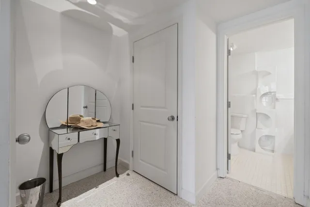 a bathroom with a shower and a toilet