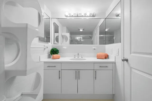 a bedroom with a bed and a chair