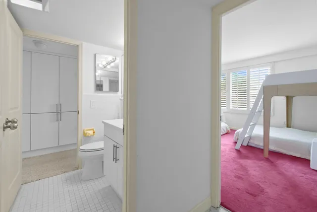 a en suite bathroom with a sink a toilet and a shower