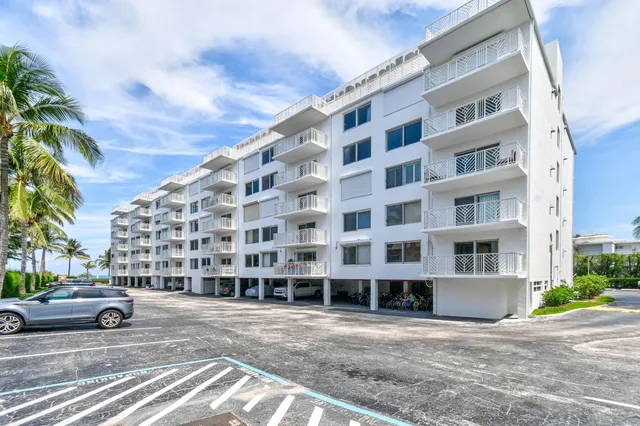 a view of building with parking area