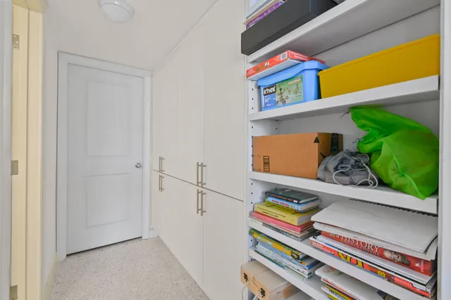 a view of a chairs and table in patio with a swimming pool