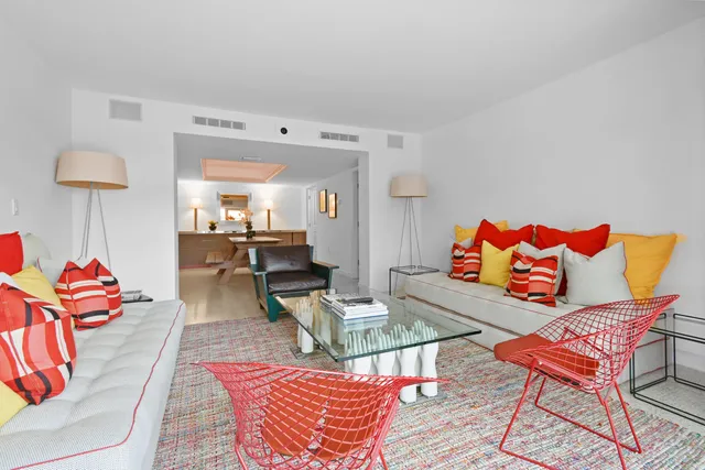 a living room with furniture and a rug