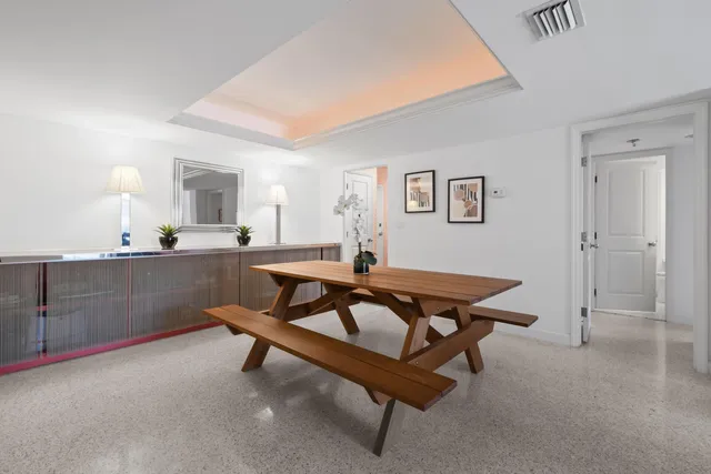 a living room with table tennis and a table