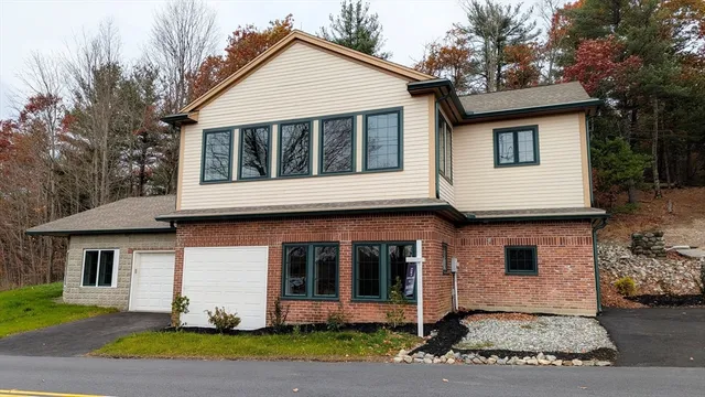 a view of a white house with a large windows