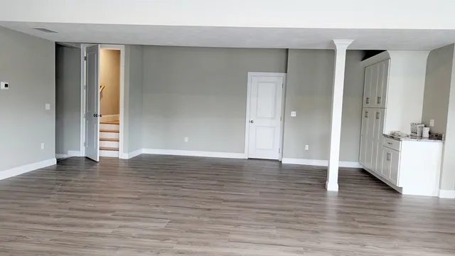 a view of a livingroom with wooden floor