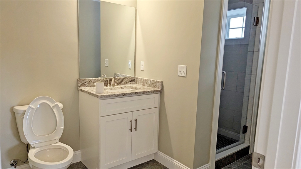 31 Cross Street Boylston, MA 01505 - Photo 28 of 42 a bathroom with a toilet sink and mirror