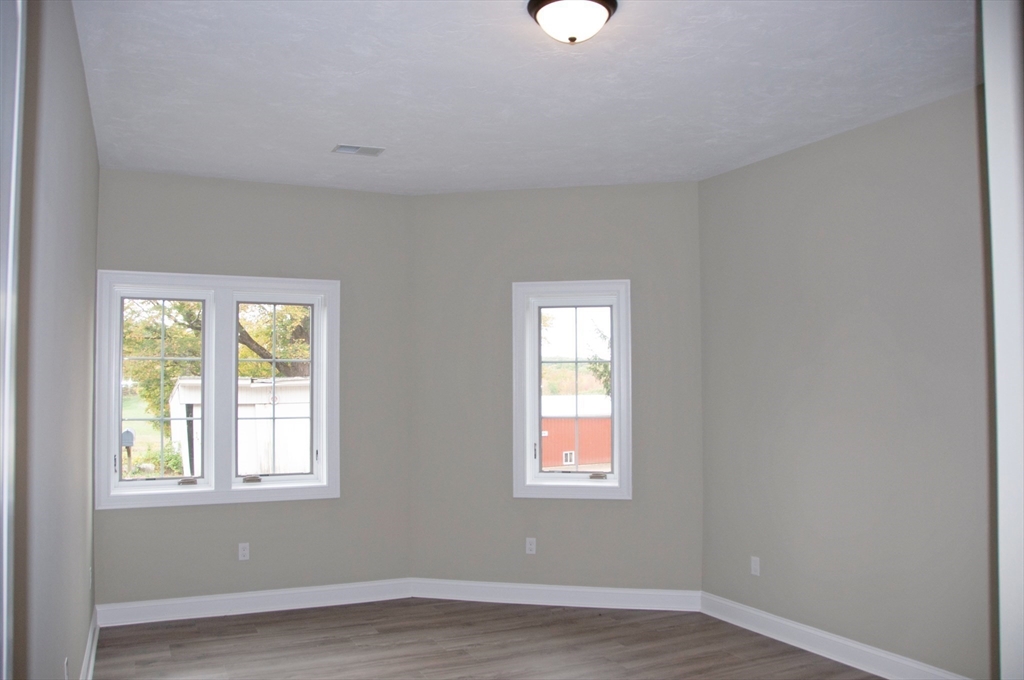 31 Cross Street Boylston, MA 01505 - Photo 33 of 42 an empty room with wooden floor and windows